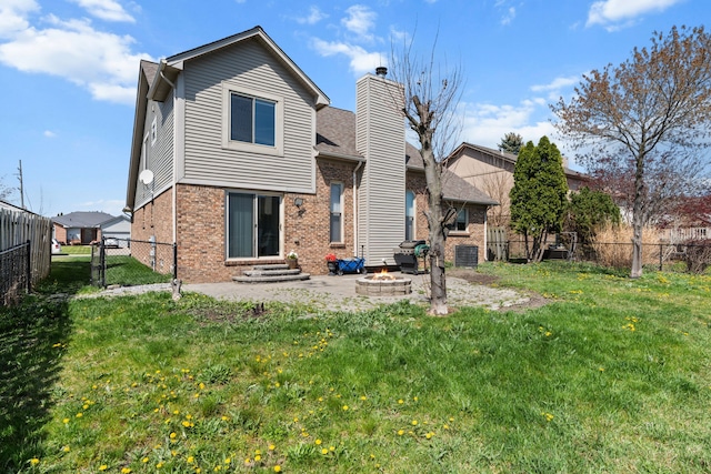 25820 Lord Dr, Chesterfield, MI 48051 - back of property with a yard, a chimney, a fenced backyard, and brick siding