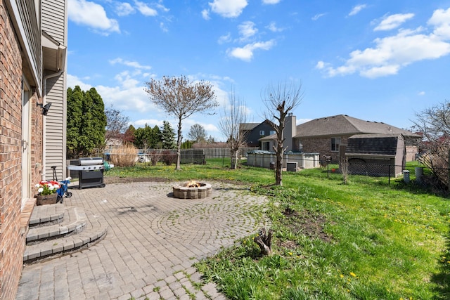 25820 Lord Dr, Chesterfield, MI 48051 - view of yard featuring a fire pit, a fenced backyard, and a patio area