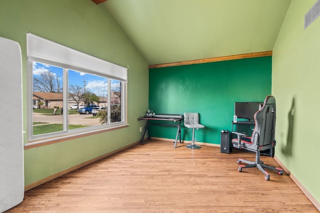 25820 Lord Dr, Chesterfield, MI 48051 - home office with lofted ceiling, wood finished floors, visible vents, and baseboards