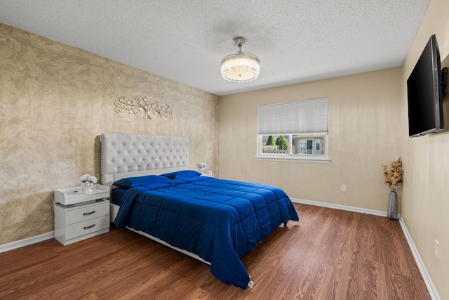 25820 Lord Dr, Chesterfield, MI 48051 - bedroom featuring a textured ceiling, wood finished floors, and baseboards
