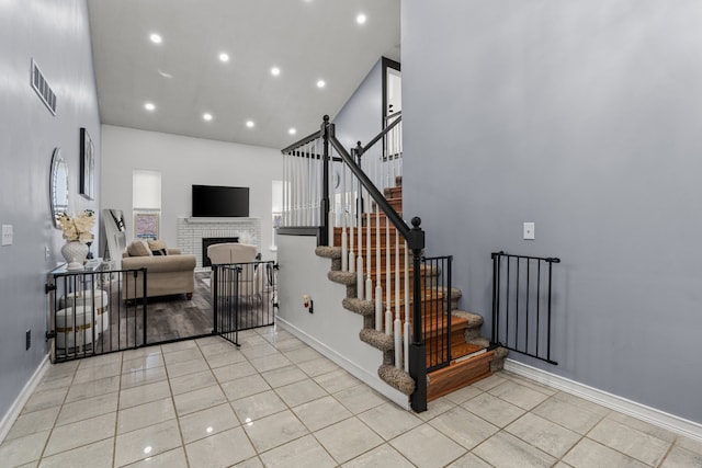 25820 Lord Dr, Chesterfield, MI 48051 - stairway featuring tile patterned floors, visible vents, recessed lighting, and a high ceiling