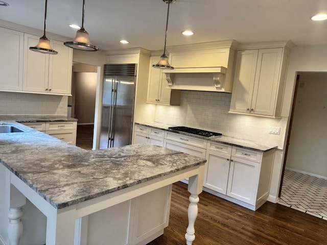 35315 Regency Ln, Farmington Hills, MI 48331 - kitchen featuring built in fridge, black cooktop, white cabinets, tasteful backsplash, and recessed lighting