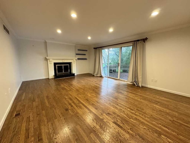 35315 Regency Ln, Farmington Hills, MI 48331 - unfurnished living room featuring crown molding, dark wood-style floors, recessed lighting, baseboards, and a fireplace with raised hearth