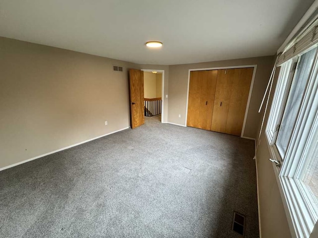 35315 Regency Ln, Farmington Hills, MI 48331 - unfurnished bedroom with carpet flooring, baseboards, and a closet