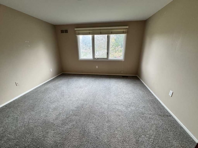 35315 Regency Ln, Farmington Hills, MI 48331 - carpeted empty room featuring baseboards