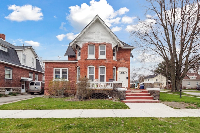 2602 Gratiot Ave, Port Huron, MI 48060 - view of front facade with a front lawn and brick siding