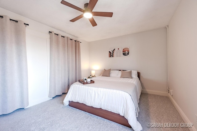bedroom featuring a ceiling fan, carpet flooring, and baseboards