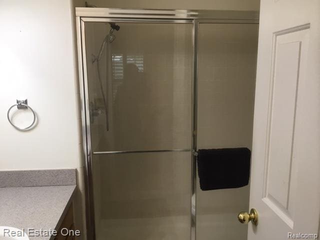 41171 Worthington, Clinton Township, MI 48038 - full bath featuring a shower with door and vanity