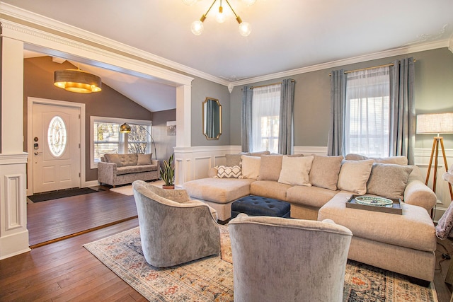 living room with plenty of natural light, wood-type flooring, and crown molding