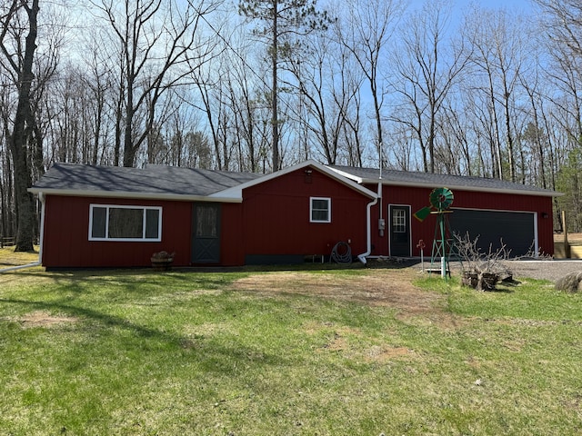 single story home featuring driveway, a front lawn, and a garage