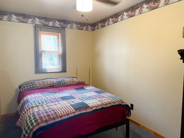 bedroom featuring a ceiling fan, carpet flooring, and baseboards