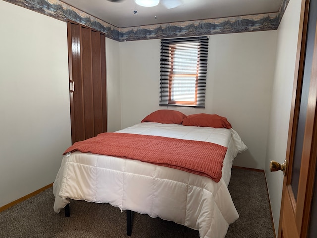bedroom featuring baseboards and carpet floors