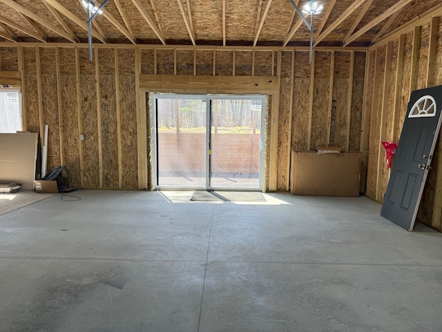 miscellaneous room with concrete floors and a garage