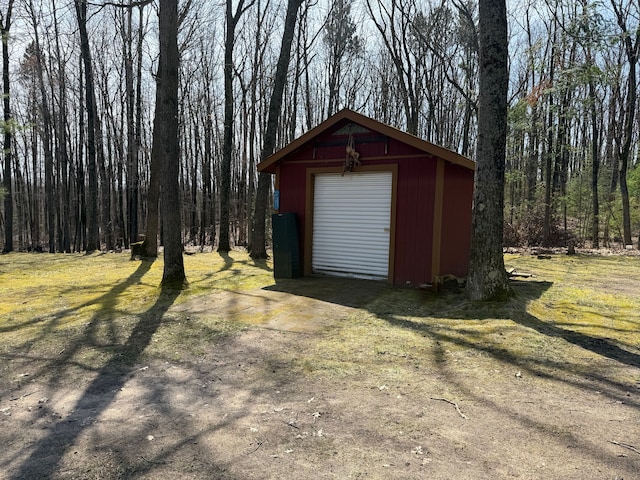 view of outdoor structure with an outdoor structure and a forest view