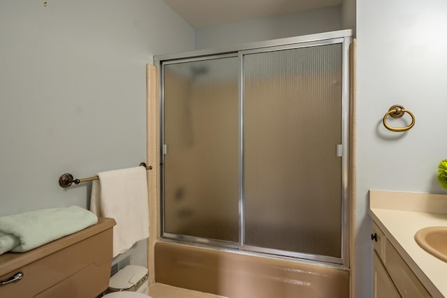 full bath with toilet, combined bath / shower with glass door, and vanity