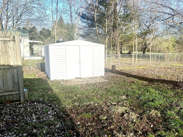 view of shed with a fenced backyard
