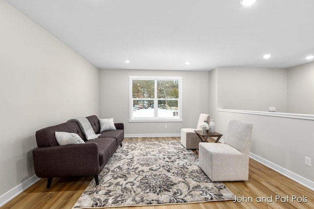 living room with recessed lighting, wood finished floors, and baseboards