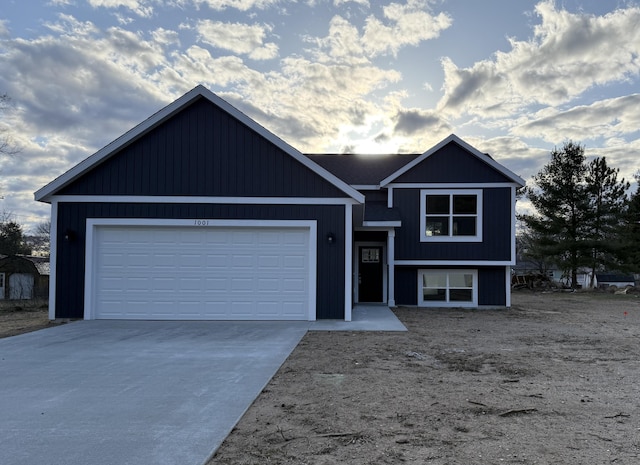 view of front of home featuring driveway and an attached garage
