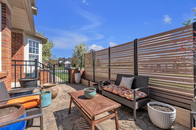 view of patio / terrace featuring fence