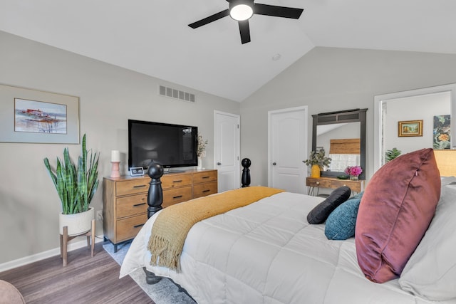 bedroom with ceiling fan, visible vents, wood finished floors, baseboards, and high vaulted ceiling
