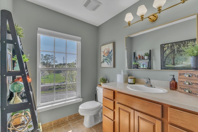 bathroom featuring visible vents, an inviting chandelier, tile patterned flooring, vanity, and toilet
