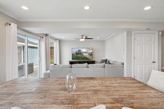 dining space with crown molding, a ceiling fan, and recessed lighting