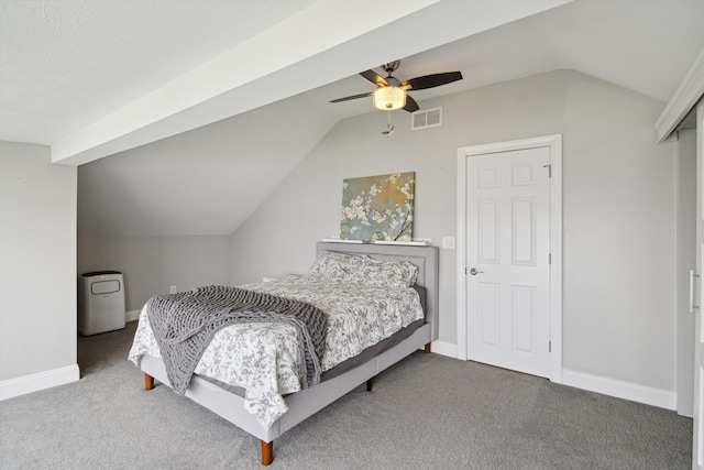 bedroom with visible vents, baseboards, ceiling fan, carpet flooring, and vaulted ceiling
