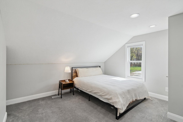 carpeted bedroom featuring baseboards, recessed lighting, and lofted ceiling