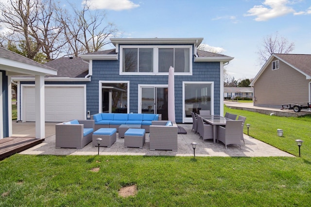 rear view of property with a yard, a patio, an outdoor living space, and a shingled roof