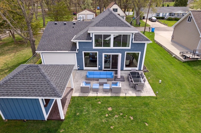 back of house featuring roof with shingles, a patio area, an outdoor hangout area, a yard, and an attached garage
