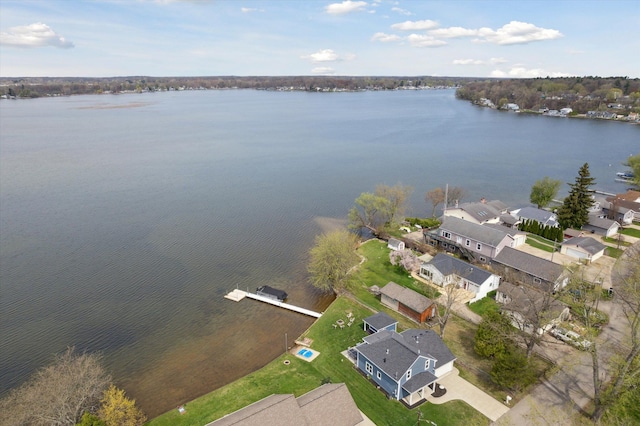 birds eye view of property featuring a residential view and a water view
