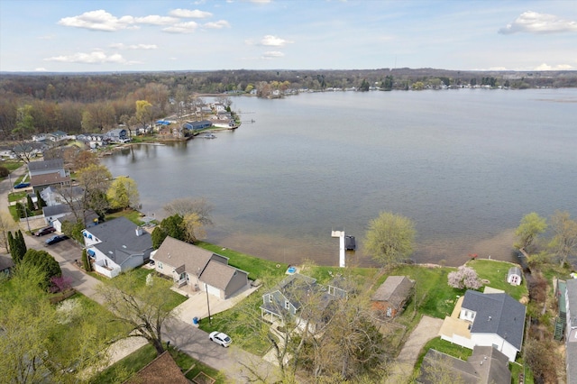 birds eye view of property with a water view and a residential view