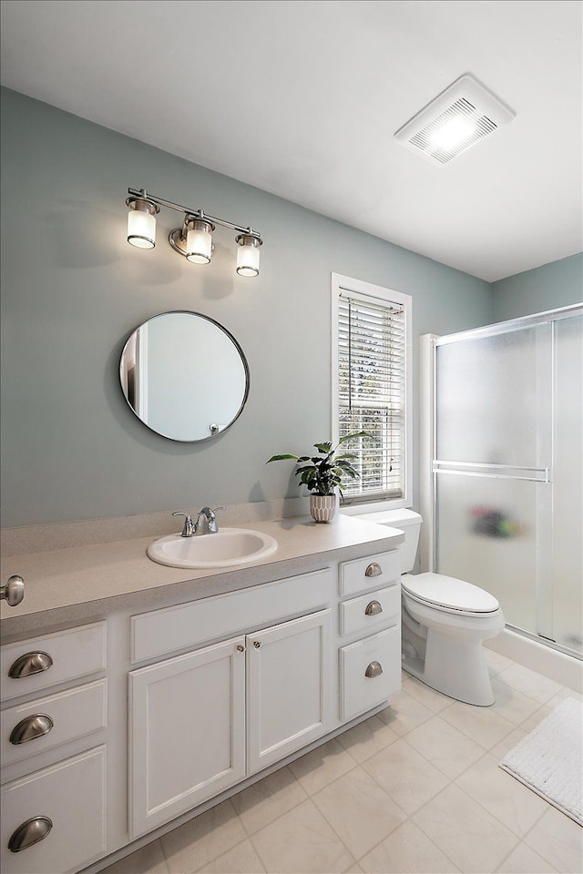 full bathroom featuring a shower stall, vanity, toilet, visible vents, and tile patterned flooring