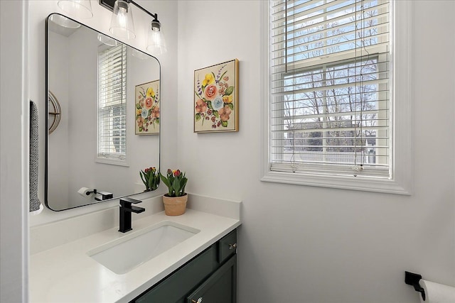 bathroom with vanity and plenty of natural light
