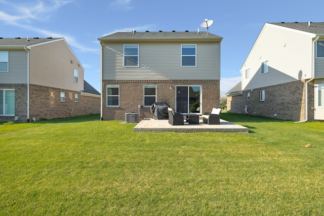 back of house with a patio, brick siding, a lawn, and central air condition unit