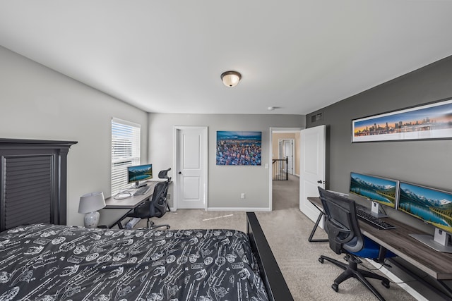 carpeted bedroom featuring baseboards and visible vents