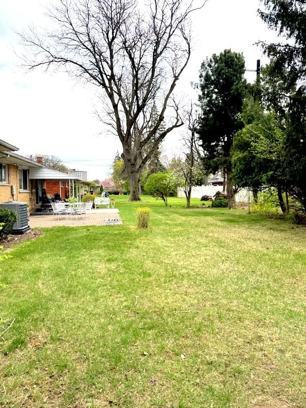 18337 Greenwald Dr, Southfield, MI 48075 - view of yard featuring a patio and central AC unit