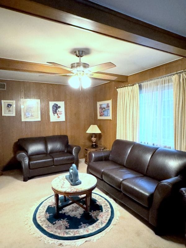 18337 Greenwald Dr, Southfield, MI 48075 - carpeted living area featuring a ceiling fan, beam ceiling, and wooden walls