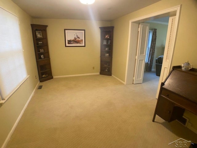68 Davis Dr, Saginaw, MI 48602 - interior space featuring light colored carpet, visible vents, a healthy amount of sunlight, and baseboards