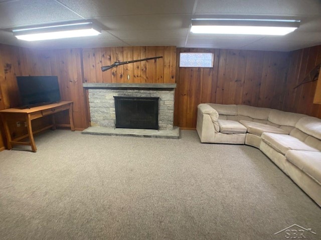 68 Davis Dr, Saginaw, MI 48602 - carpeted living area with wooden walls and a fireplace