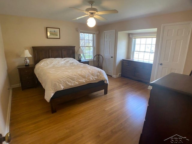 68 Davis Dr, Saginaw, MI 48602 - bedroom with light wood-type flooring, a ceiling fan, and baseboards