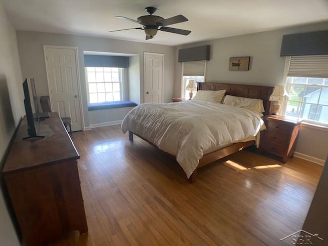 68 Davis Dr, Saginaw, MI 48602 - bedroom featuring ceiling fan, wood finished floors, and baseboards