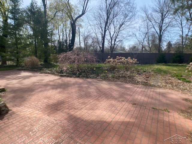 68 Davis Dr, Saginaw, MI 48602 - deck featuring a patio area and fence