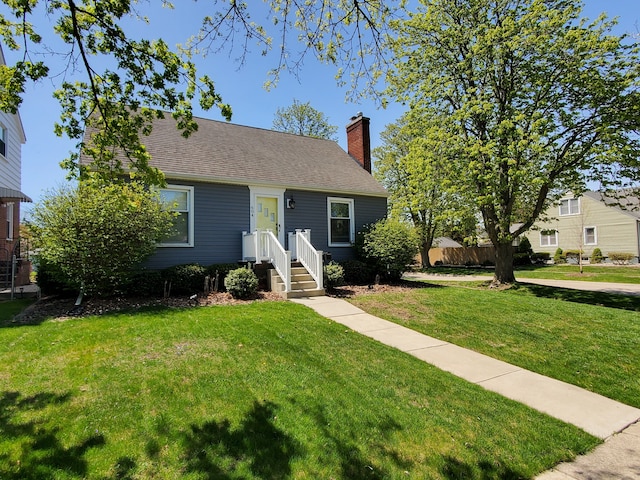 bungalow-style home with a shingled roof, a front lawn, fence, and a chimney