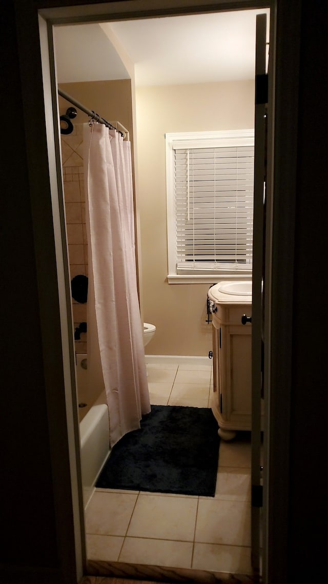 full bathroom with vanity, tile patterned flooring, toilet, and shower / tub combo with curtain