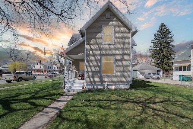 701 N Saginaw St, Durand, MI 48429 - exterior space featuring a lawn, fence, and a porch