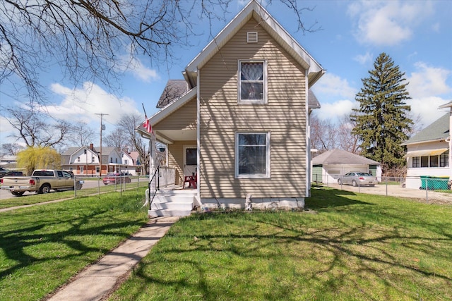 701 N Saginaw St, Durand, MI 48429 - view of front of property featuring a porch, fence, and a front yard