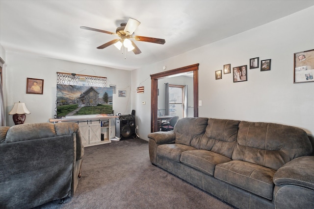 701 N Saginaw St, Durand, MI 48429 - living area with dark colored carpet and ceiling fan