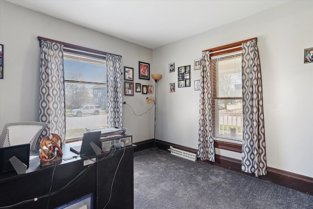 701 N Saginaw St, Durand, MI 48429 - office area with baseboards and dark carpet
