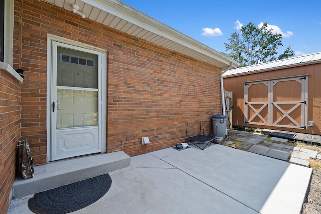 2250 Saines Manor Dr, Jackson, MI 49201 - property entrance with brick siding and a patio area